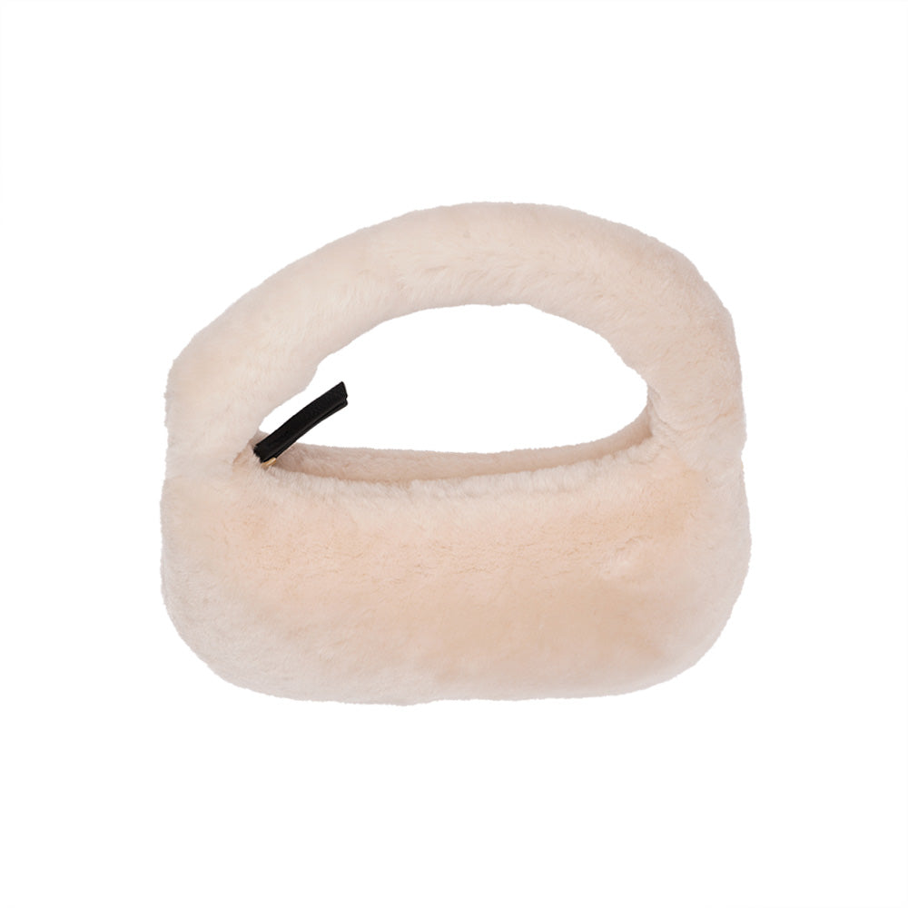 Lovelies Studio - Zhamo is a beautiful small shearling handbag which is perfect for carrying your essentials with you.  * Top handle in thick shearling   * Adjustable and detachable shoulder strap in leather   * Satin lining and flat zipped inner pocket   * Item comes with a branded dust bag.   * Gold-toned hardware   * Messurements W26 X D6 X H24 cm   * 100 % Australian shearling