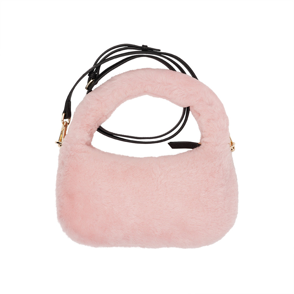 Lovelies Studio - Zhamo is a beautiful small shearling handbag which is perfect for carrying your essentials with you.  * Top handle in thick shearling   * Adjustable and detachable shoulder strap in leather   * Satin lining and flat zipped inner pocket   * Item comes with a branded dust bag.   * Gold-toned hardware   * Messurements W26 X D6 X H24 cm   * 100 % Australian shearling