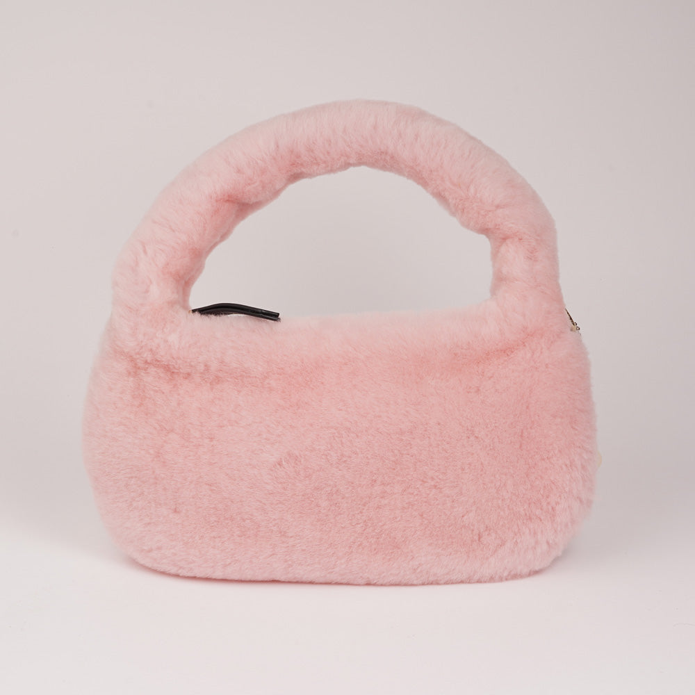 Lovelies Studio - Zhamo is a beautiful small shearling handbag which is perfect for carrying your essentials with you.  * Top handle in thick shearling   * Adjustable and detachable shoulder strap in leather   * Satin lining and flat zipped inner pocket   * Item comes with a branded dust bag.   * Gold-toned hardware   * Messurements W26 X D6 X H24 cm   * 100 % Australian shearling