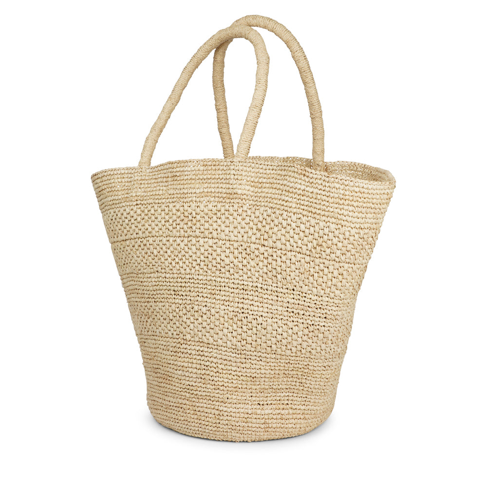 Anakao, the charming bag fashioned from luxurious raffia sourced from Madagascar.

Tailored for your everyday adventures, this tote boasts a spacious main compartment to accommodate all your necessities while you're on the move.

Raffia, derived from the resilient leaves of the palm tree, is celebrated for its versatility and eco-conscious qualities, making it a sought-after material in the realm of fashion accessories.

Handcrafted with precision, raffia handbags epitomize a blend of casual sophistication,