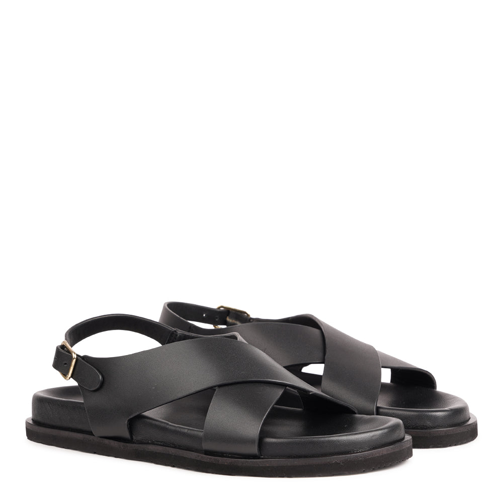 Bologna — a beautifully handcrafted leather sandal designed to balance feminine elegance with everyday comfort. A single adjustable buckle ensures a secure, personalized fit that moves with you throughout the day.

Made from vegetable-tanned buffalo leather, the soft yet durable straps are built to age beautifully over time. Finished with a discreet rubber grip, Bologna offers both stability and ease - perfect for effortless daytime wear and refined evening looks.