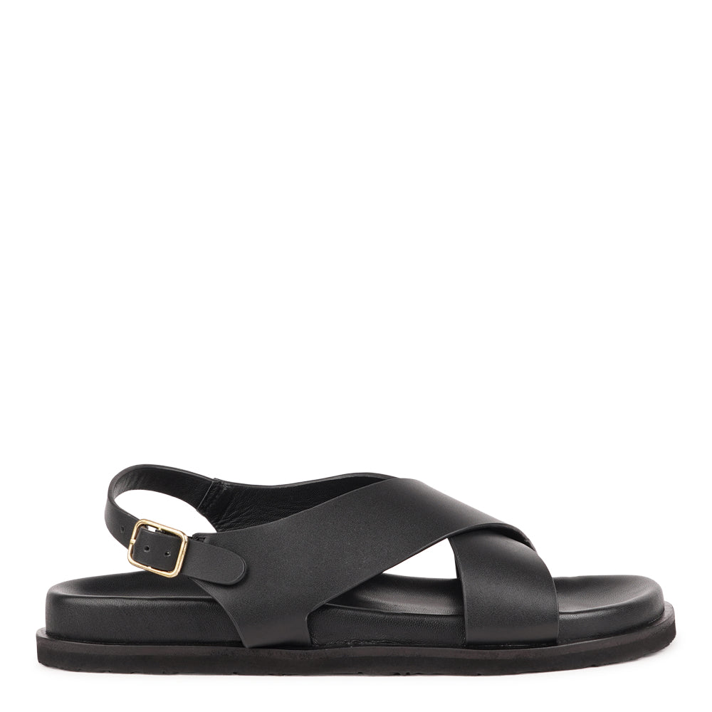 Bologna — a beautifully handcrafted leather sandal designed to balance feminine elegance with everyday comfort. A single adjustable buckle ensures a secure, personalized fit that moves with you throughout the day.

Made from vegetable-tanned buffalo leather, the soft yet durable straps are built to age beautifully over time. Finished with a discreet rubber grip, Bologna offers both stability and ease - perfect for effortless daytime wear and refined evening looks.