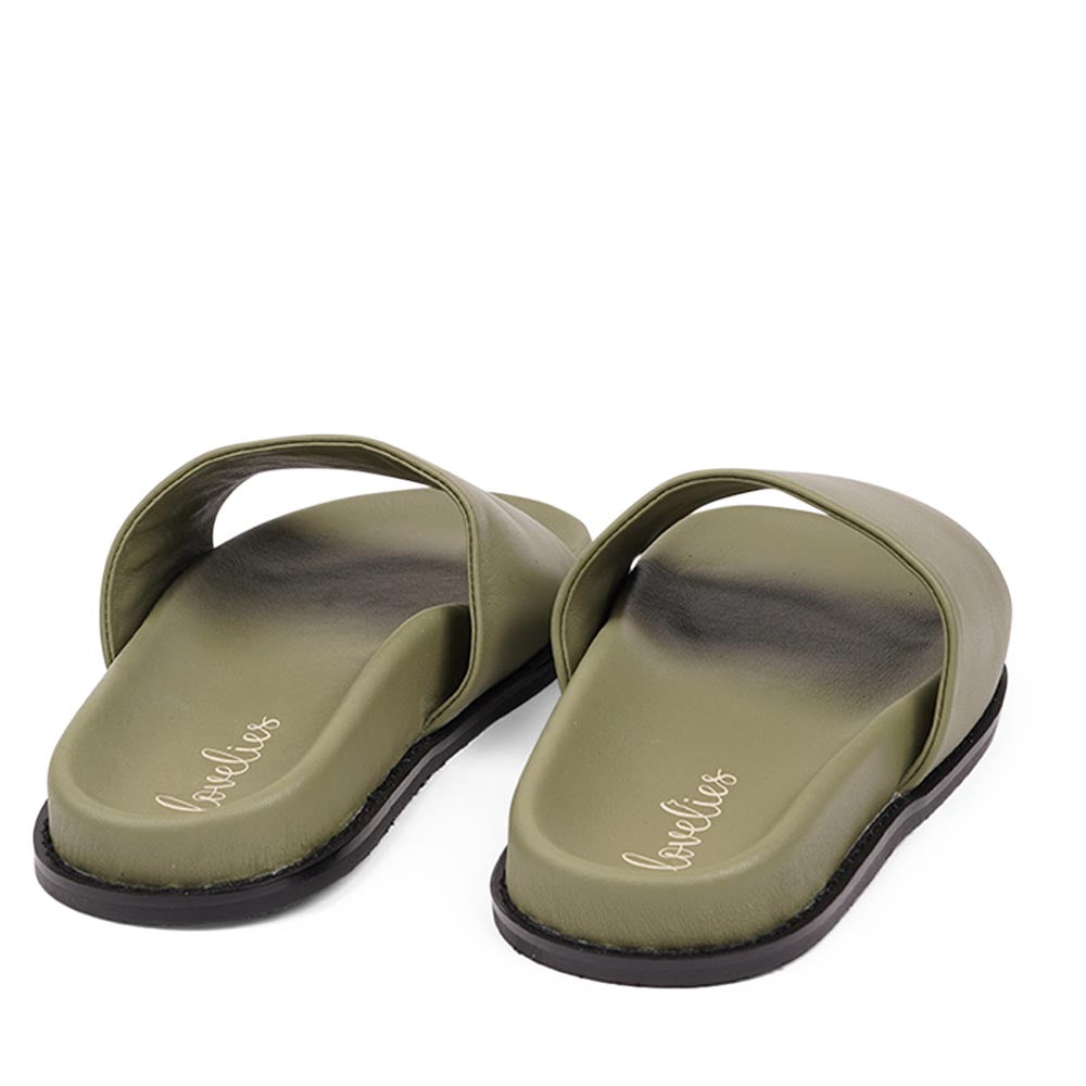 Lovelies Studio - Exclusive Nappa Leather Slide Sandals

Step into effortless elegance with our exclusive slide sandals, crafted with a soft rubber sole wrapped in luxurious nappa leather. Designed for all-day comfort, the adjustable velcro leather straps ensure a secure and personalized fit.

The supple nappa leather and sleek silhouette create a refined yet relaxed look-perfect with a flowing summer dress or your favorite jeans.