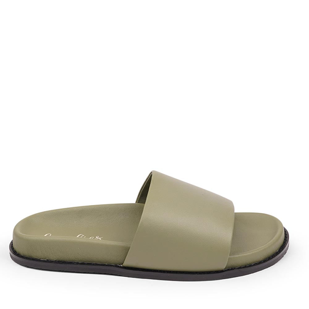 Lovelies Studio - Exclusive Nappa Leather Slide Sandals

Step into effortless elegance with our exclusive slide sandals, crafted with a soft rubber sole wrapped in luxurious nappa leather. Designed for all-day comfort, the adjustable velcro leather straps ensure a secure and personalized fit.

The supple nappa leather and sleek silhouette create a refined yet relaxed look-perfect with a flowing summer dress or your favorite jeans.