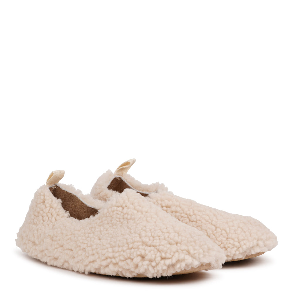 Lovelies Studio - Denmark - Step into everyday luxury with Comiano. Crafted from plush, natural shearling and finished with a durable leather sole, these slippers offer exceptional warmth, softness, and timeless style. Perfect for cosy moments at home, they gently mould to your feet for a personalised fit and lasting comfort.