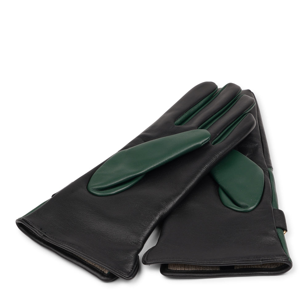 The Ferrara gloves are crafted from supple leather and lined with rich cashmere, offering warmth and lasting comfort. With their feminine silhouette, adjustable cuff strap, and choice of two colors, they blend timeless elegance with everyday practicality.