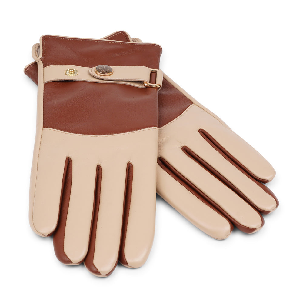The Ferrara gloves are crafted from supple leather and lined with rich cashmere, offering warmth and lasting comfort. With their feminine silhouette, adjustable cuff strap, and choice of two colors, they blend timeless elegance with everyday practicality.