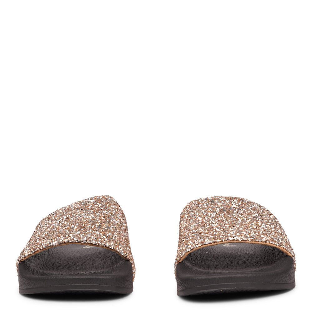 Shine all summer with Fontazzi Glitter Slides!

Perfect for any occasion, these slides feature a full glitter design that adds a touch of sparkle to your look. With a durable yet soft rubber sole, they offer all-day comfort whether you're partying or lounging by the beach.

Step into the spotlight with Fontazzi – the ultimate combination of fun, comfort, and shine!
