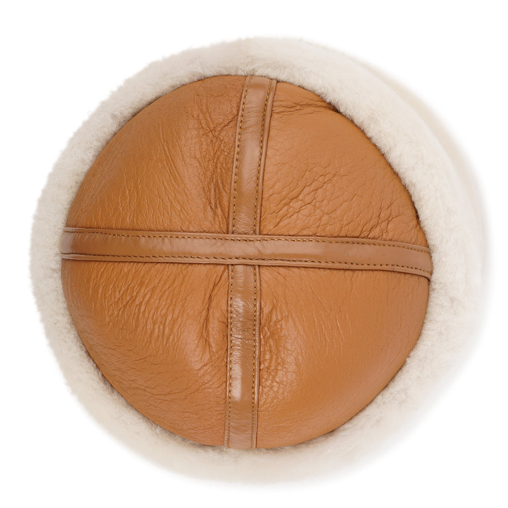Stay warm and stylish this winter with the Kakani Shearling Hat, a perfect addition to your wardrobe.

Crafted from 100% sheepskin, this hat combines elegance and practicality. The lightweight material provides excellent insulation for cold days and naturally regulates temperature, making it versatile enough to wear into the spring.
