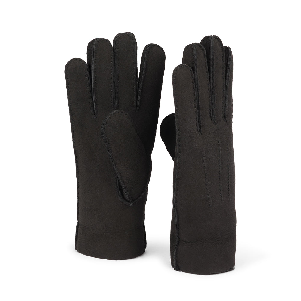 Where Elegance Meets Warmth  Elevate your winter wardrobe with our luxurious Kelly Shearling Gloves. Crafted from supple sheep leather, these gloves are designed to provide you with both style and warmth during the colder months.  These gloves are uniquely long and slim, providing a sleek and feminine silhouette that not only keeps you warm but also adds a chic touch to any outfit.