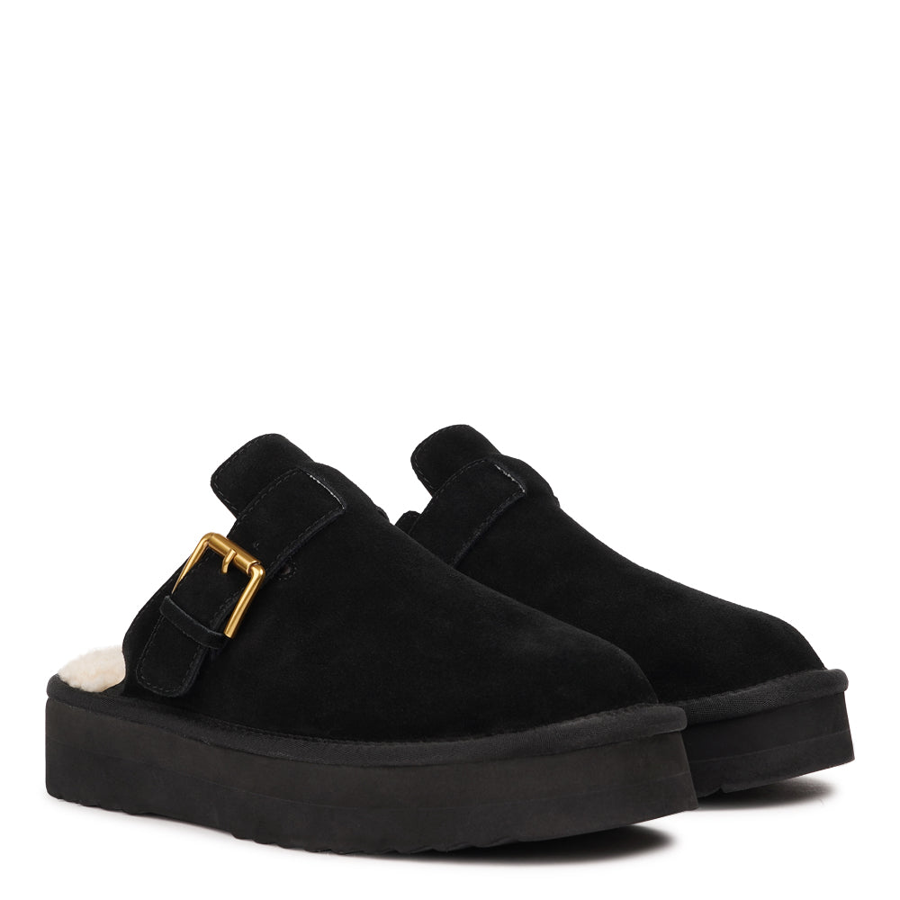 Lovelies Studio - Kokubo – Suede Mules with Adjustable Buckle
Meet Kokubo — a pair of mules that redefine everyday comfort with understated elegance. What makes them special is the plush shearling insole that gently cushions your feet, offering natural warmth and luxurious softness, even on a cold days.
Crafted from premium suede and finished with a durable rubber sole, the Kokubo mules combine style, comfort, and longevity in one effortless design. 