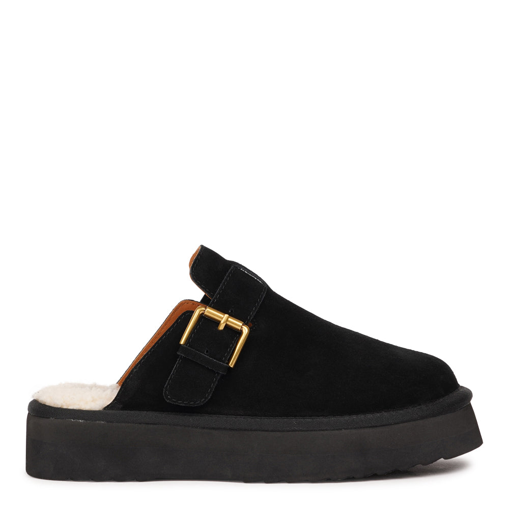 Lovelies Studio - Kokubo – Suede Mules with Adjustable Buckle
Meet Kokubo — a pair of mules that redefine everyday comfort with understated elegance. What makes them special is the plush shearling insole that gently cushions your feet, offering natural warmth and luxurious softness, even on a cold days.
Crafted from premium suede and finished with a durable rubber sole, the Kokubo mules combine style, comfort, and longevity in one effortless design. 