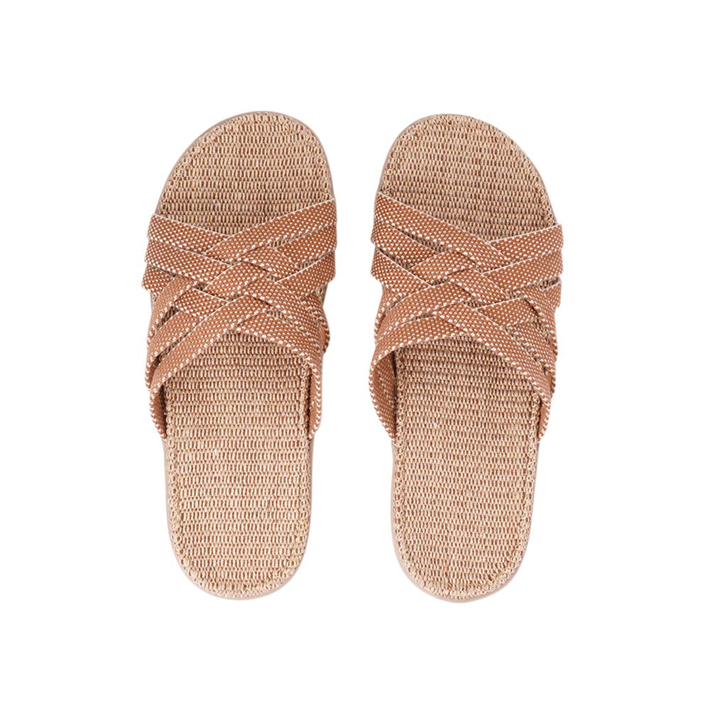 This sumptuous sandal is composed of luxuriantly soft and resilient gum rubber, with a natural jute innersole. The closely woven cotton straps infuse a delicate and fanciful aesthetic, providing an effortless sophistication for any ensemble.