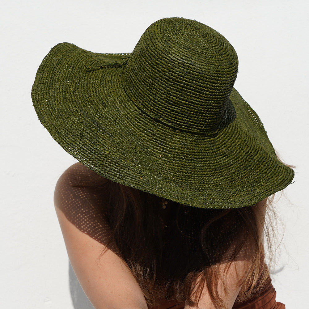 The Monti beach hat is a gorgeous piece, painstakingly crafted by talented local artisans in Madagascar, exclusively for Lovelies Studio. Each hat is a testament to the craftsmanship and devotion of these artisans, who meticulously handcraft every element with precision and care.

Crafted from raffia, a natural fiber celebrated for its strength and suppleness, the Monti hat embodies both style and sustainability. Utilizing traditional methods, the raffia is hand-dyed and left to bask in the sun, minimizing 