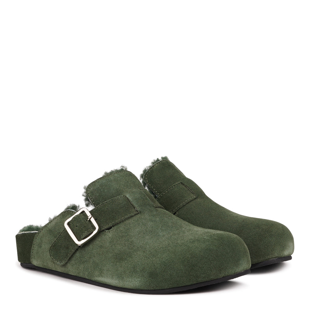 Lovelies Studio - The Nesso Suede Mules are the epitome of luxurious comfort and style. Crafted with a premium suede upper, these exclusive mules feature an adjustable buckle for a customized fit. Lined with soft curly shearling, they provide warmth and a cozy feel, perfect for cooler days.