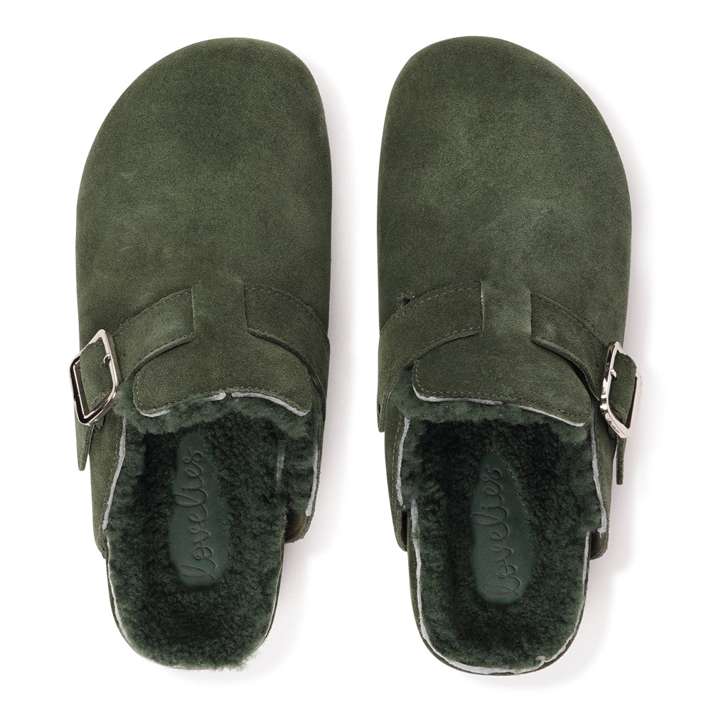 Lovelies Studio - The Nesso Suede Mules are the epitome of luxurious comfort and style. Crafted with a premium suede upper, these exclusive mules feature an adjustable buckle for a customized fit. Lined with soft curly shearling, they provide warmth and a cozy feel, perfect for cooler days.