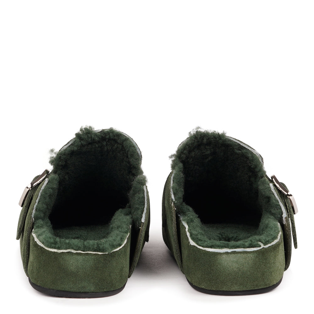 Lovelies Studio - The Nesso Suede Mules are the epitome of luxurious comfort and style. Crafted with a premium suede upper, these exclusive mules feature an adjustable buckle for a customized fit. Lined with soft curly shearling, they provide warmth and a cozy feel, perfect for cooler days.