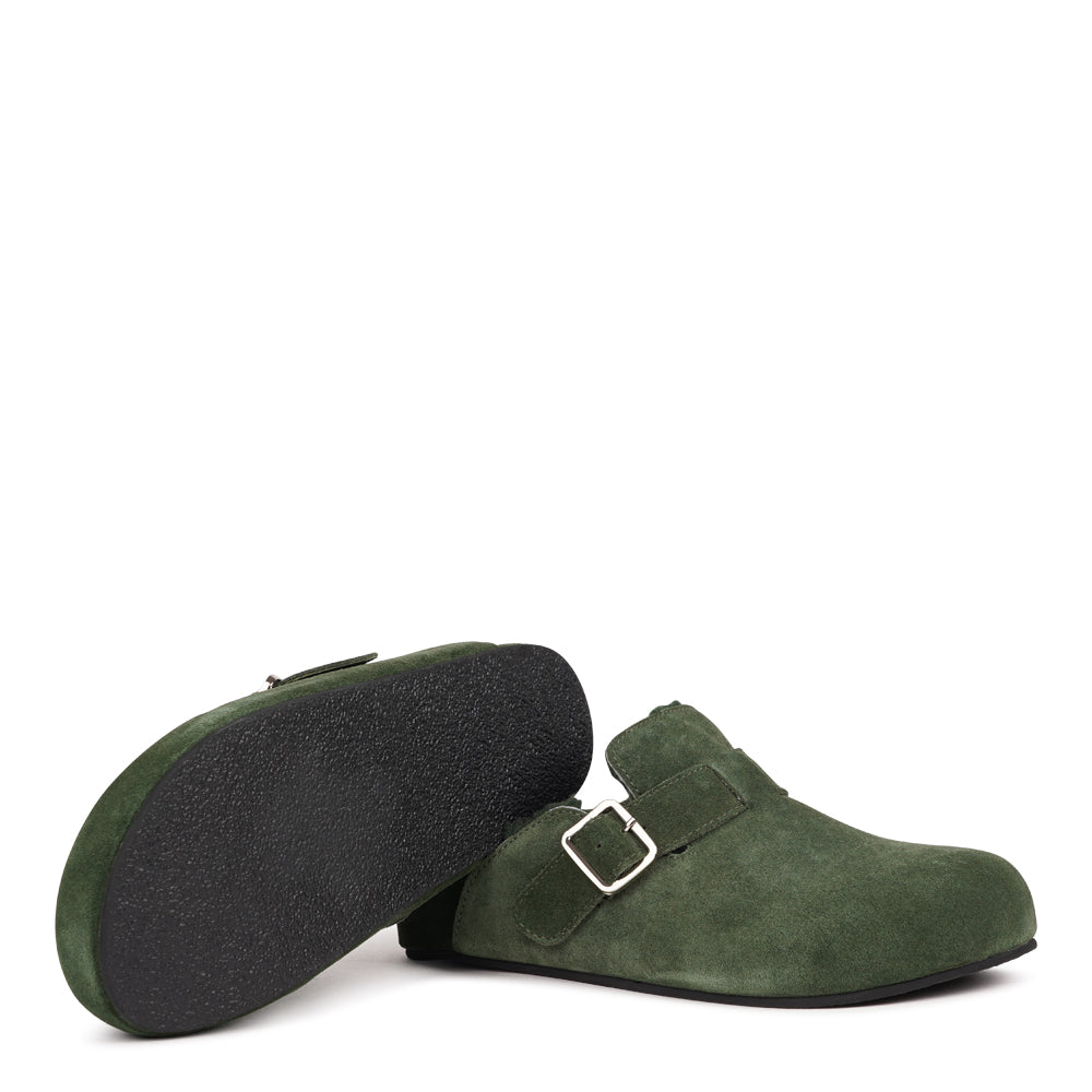 Lovelies Studio - The Nesso Suede Mules are the epitome of luxurious comfort and style. Crafted with a premium suede upper, these exclusive mules feature an adjustable buckle for a customized fit. Lined with soft curly shearling, they provide warmth and a cozy feel, perfect for cooler days.