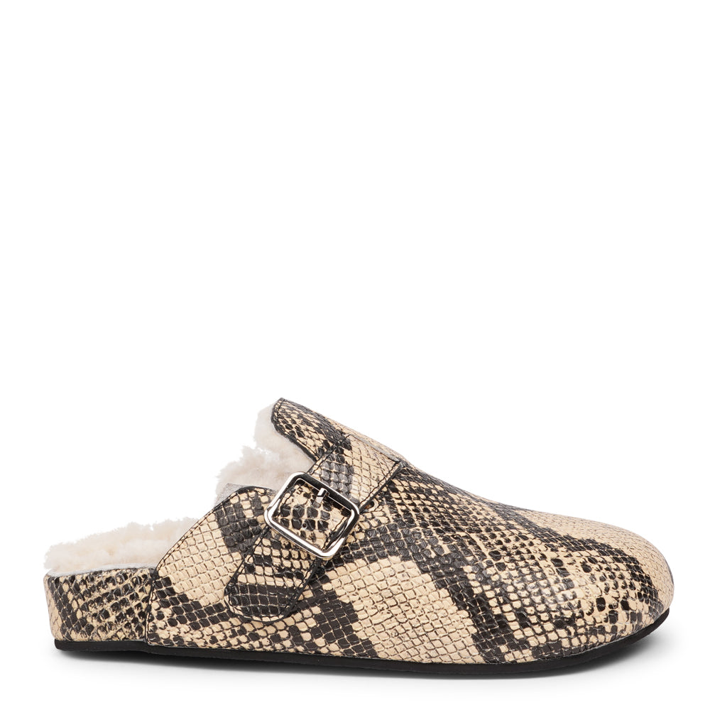 Lovelies Studio - The Nesso Snake Mules are the epitome of luxurious comfort and style. Crafted with a premium leather upper, these exclusive mules feature an adjustable buckle for a customized fit. Lined with soft curly shearling, they provide warmth and a cozy feel, perfect for cooler days.