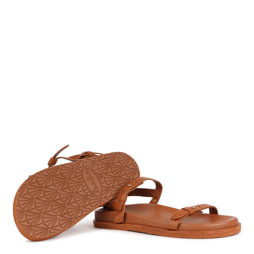 Lovelies Studio - Ravello - a handcrafted leather sandal that combines feminine elegance with everyday comfort. Designed with slim, adjustable straps, it offers a secure, personalized fit that moves effortlessly with you throughout the day.

Crafted from vegetable-tanned buffalo leather, the soft yet durable straps are made to age beautifully over time. A soft leather insole and a durable rubber outsole provide stability and ease - perfect for both relaxed daytime wear and more refined evening looks.