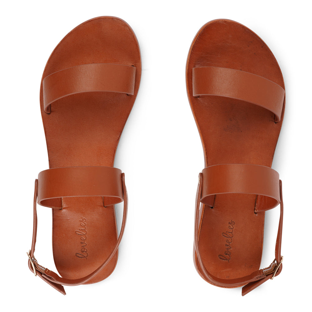 Samo is our finely handcrafted leather sandal, designed to combine graceful style with all-day comfort. Featuring a single adjustable buckle on the heel strap, it provides a secure, custom fit that moves effortlessly with you.

Made from vegetable-tanned buffalo leather, the soft yet durable straps promise long-lasting wear. The leather sole with a rubber grip delivers dependable stability, making Samo the perfect choice for everything from casual outings to more refined occasions.