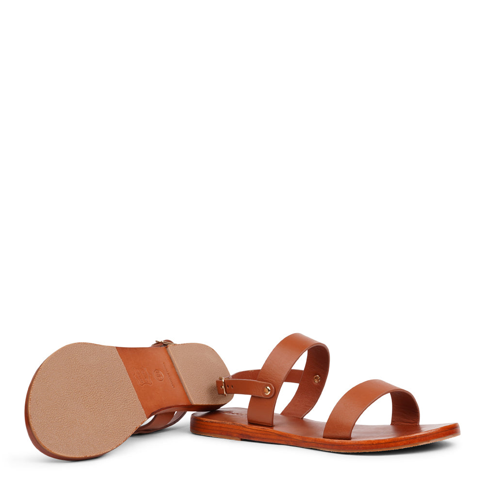 Samo is our finely handcrafted leather sandal, designed to combine graceful style with all-day comfort. Featuring a single adjustable buckle on the heel strap, it provides a secure, custom fit that moves effortlessly with you.

Made from vegetable-tanned buffalo leather, the soft yet durable straps promise long-lasting wear. The leather sole with a rubber grip delivers dependable stability, making Samo the perfect choice for everything from casual outings to more refined occasions.