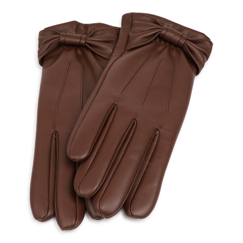 Lovelies Studio - The Sondrio gloves are a refined blend of style and luxury, crafted from supple lambskin and adorned with a charming bow detail. Lined with soft cashmere, these gloves provide exceptional warmth and comfort.

Their elegant design and sophisticated touch make Sondrio a perfect accessory for adding a bit of glamour to your winter wardrobe.