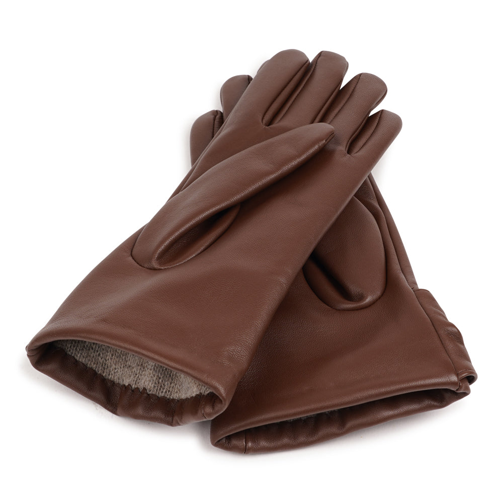 Lovelies Studio - The Sondrio gloves are a refined blend of style and luxury, crafted from supple lambskin and adorned with a charming bow detail. Lined with soft cashmere, these gloves provide exceptional warmth and comfort.

Their elegant design and sophisticated touch make Sondrio a perfect accessory for adding a bit of glamour to your winter wardrobe.
