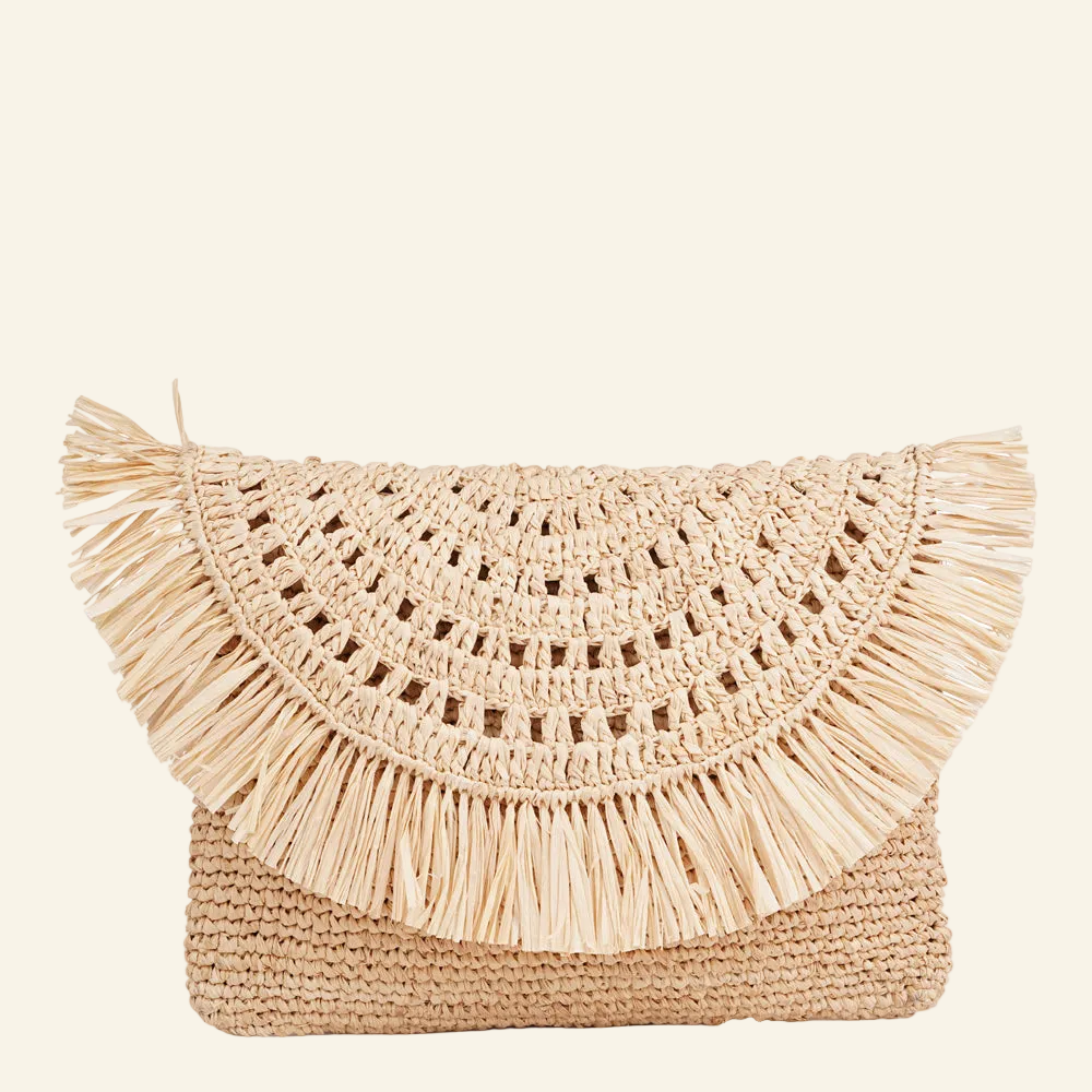 Lovelies - Tazzoli – a charming little clutch crafted from luxurious raffia.

Made from natural palm leaves, raffia is loved for its light feel and easy, eco-friendly appeal. Handwoven with care, this bag blends a relaxed vibe with a touch of elegance - perfect for both everyday moments and special occasions.

With its soft texture and natural tones, it adds effortless style to any look. Lightweight yet durable, Tazzoli is designed to be carried with ease, day after day.