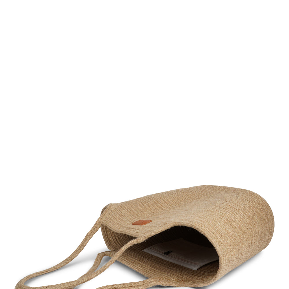 Meet the Tomba bag, where eco-friendly materials meet effortless style. Made from a durable blend of cotton and jute rope, Tomba is designed for those who love a chic, sustainable accessory that’s perfect for every day.

This two-tone stylish tote bag adds a modern touch to your look, while the long shoulder straps make it easy to carry, whether you’re out for a day of shopping, heading to the beach, or simply running errands.
Tomba – the perfect combination of style, comfort, and sustainability.