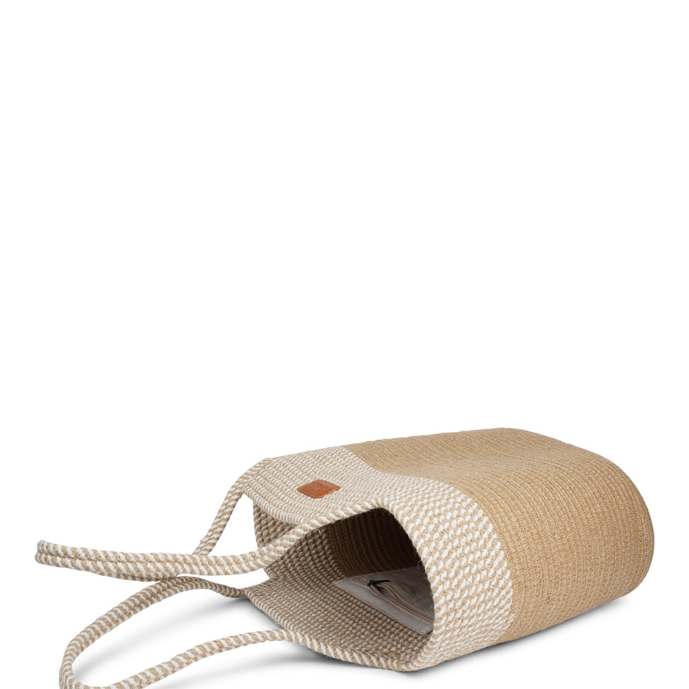 Meet the Tomba bag, where eco-friendly materials meet effortless style. Made from a durable blend of cotton and jute rope, Tomba is designed for those who love a chic, sustainable accessory that’s perfect for every day.

This two-tone stylish tote bag adds a modern touch to your look, while the long shoulder straps make it easy to carry, whether you’re out for a day of shopping, heading to the beach, or simply running errands.
Tomba – the perfect combination of style, comfort, and sustainability.