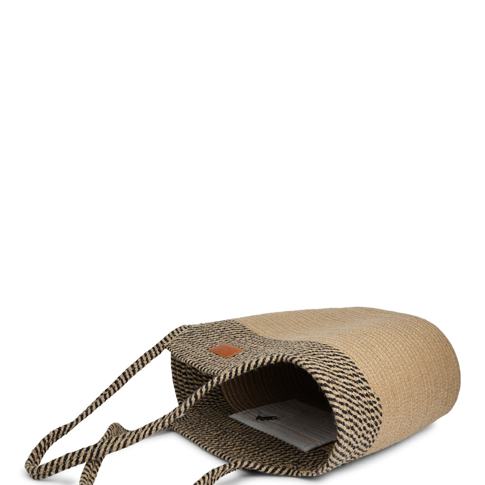 Meet the Tomba bag, where eco-friendly materials meet effortless style. Made from a durable blend of cotton and jute rope, Tomba is designed for those who love a chic, sustainable accessory that’s perfect for every day.

This two-tone stylish tote bag adds a modern touch to your look, while the long shoulder straps make it easy to carry, whether you’re out for a day of shopping, heading to the beach, or simply running errands.
Tomba – the perfect combination of style, comfort, and sustainability.