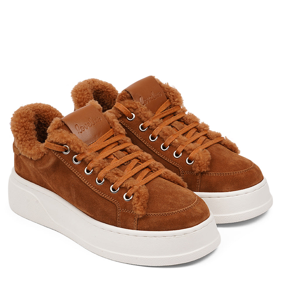 At the foundation of the Zanja low sneaker lies a soft yet durable rubber sole, ensuring long-lasting wear and exceptional grip.   The upper is adorned with suede and features charming shearling details, adding a touch of luxury to your every step. Whether you're dressing up for a night out or aiming for a more casual look, these sneakers effortlessly elevate your style.