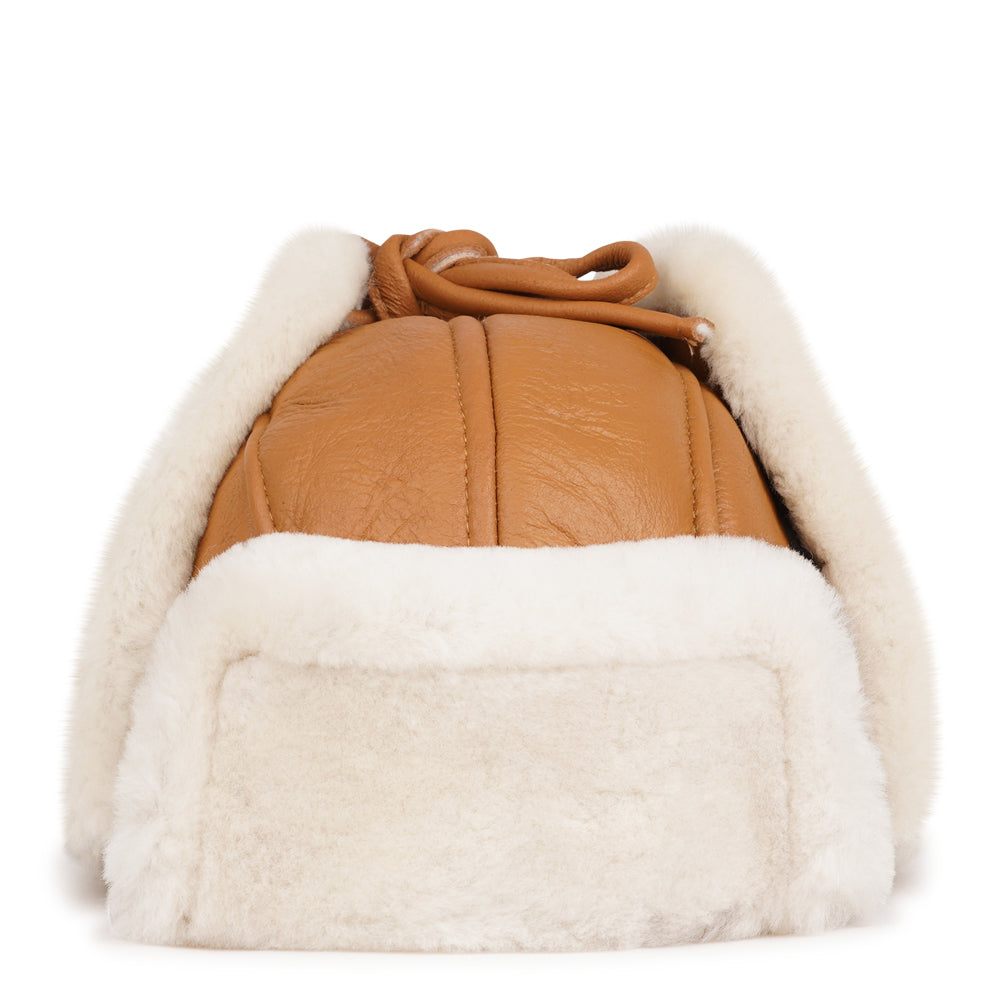 Lovelies Studio - Denmark - The unique design of the Zhuomala One Side Shearling Hat features a one-sided shearling construction, ensuring both warmth and a distinctive flair. The natural insulating properties of Australian sheepskin make this hat a reliable companion against the winter chill, providing a cocoon of coziness for your head and ears.