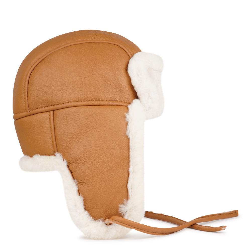 Lovelies Studio - Denmark - The unique design of the Zhuomala One Side Shearling Hat features a one-sided shearling construction, ensuring both warmth and a distinctive flair. The natural insulating properties of Australian sheepskin make this hat a reliable companion against the winter chill, providing a cocoon of coziness for your head and ears.
