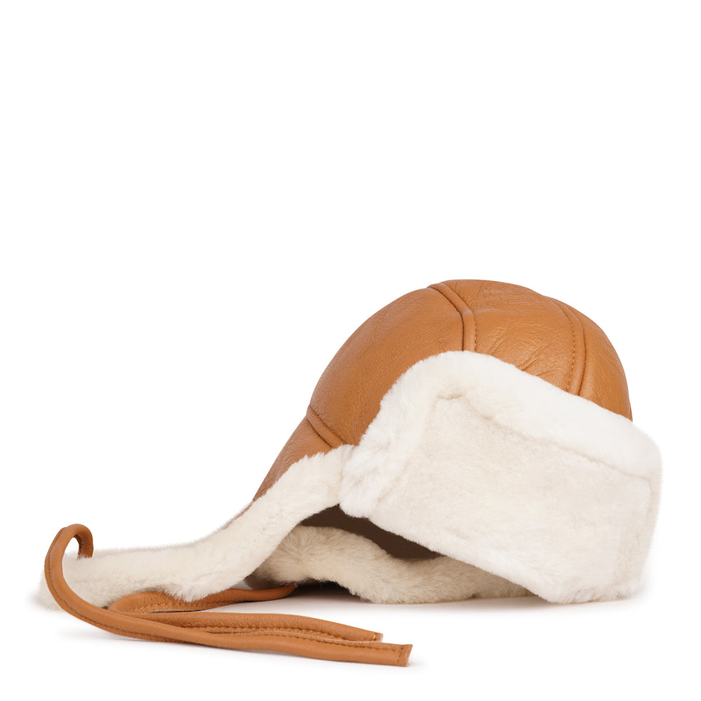Lovelies Studio - Denmark - The unique design of the Zhuomala One Side Shearling Hat features a one-sided shearling construction, ensuring both warmth and a distinctive flair. The natural insulating properties of Australian sheepskin make this hat a reliable companion against the winter chill, providing a cocoon of coziness for your head and ears.