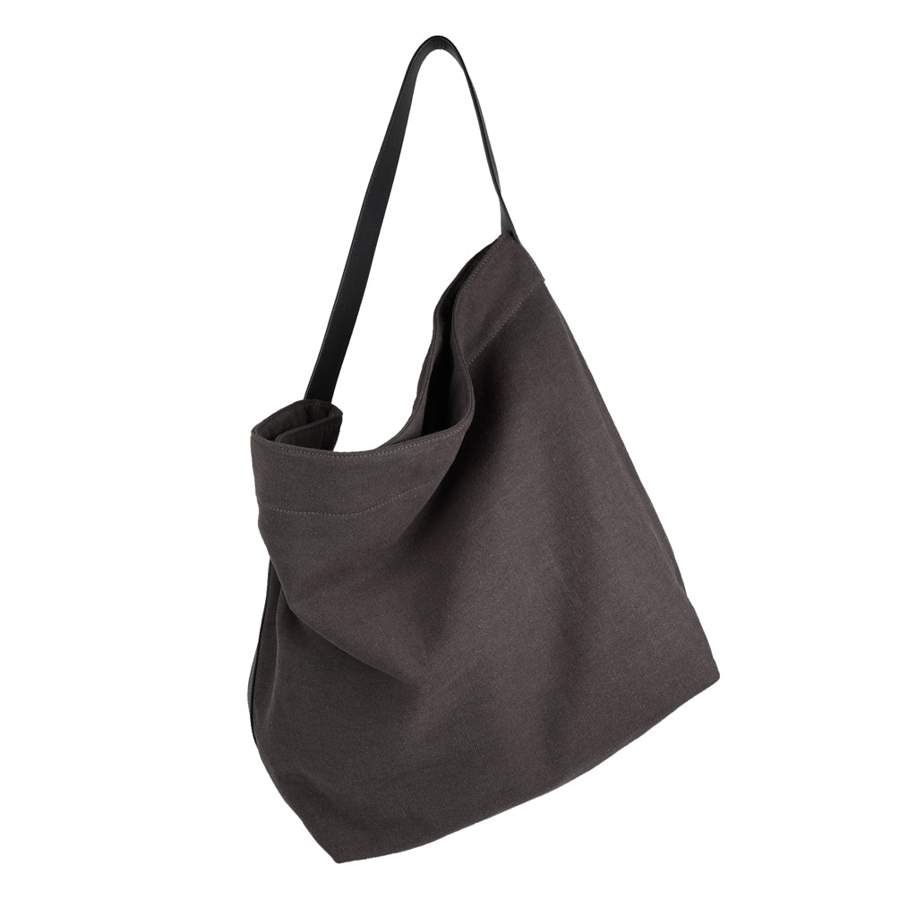 Our Lovelies casual shoulder shopper bag is made of high quality linen and a soft 100% leather handle. The bag has a large primary compartment in which you can fit in all of your stuff when you're on the go.    Inside the shopper bag there's a magnetic button closure at the top as well as a  phone pocket.  60% Linen & 40% Cotton   Double Lining   100% Leather handle  Inside phone pocket  Size H41 x W52 x D20 cm