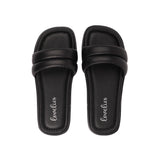Lovelies Studio - Bissi - Black These soft nappa leather sliders come with a cool puffy upper strap.  With its delicate and soft fabrics, you feel at ease and elegant at the same time. The easy to-go sandals will fit to your feminine dress or your summer jeans.