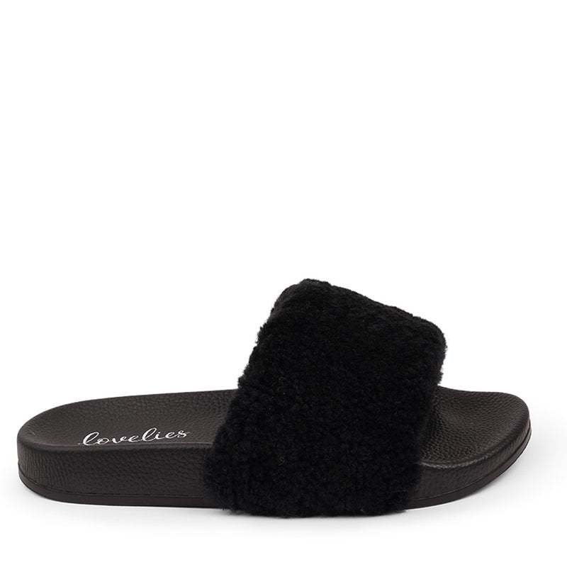 Slides with Australian Shearling upper.  This wonderful slide has a soft and light rubber sole which makes it very comfortable and an all time favorite sandal. The 100% shearling wool will keep you warm or cool you down on hot summer days.