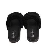 Slides with Australian Shearling upper.  This wonderful slide has a soft and light rubber sole which makes it very comfortable and an all time favorite sandal. The 100% shearling wool will keep you warm or cool you down on hot summer days.