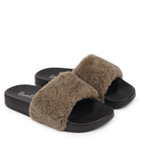Slides with Australian Shearling upper.  This wonderful slide has a soft and light rubber sole which makes it very comfortable and an all time favorite sandal. The 100% shearling wool will keep you warm or cool you down on hot summer days.