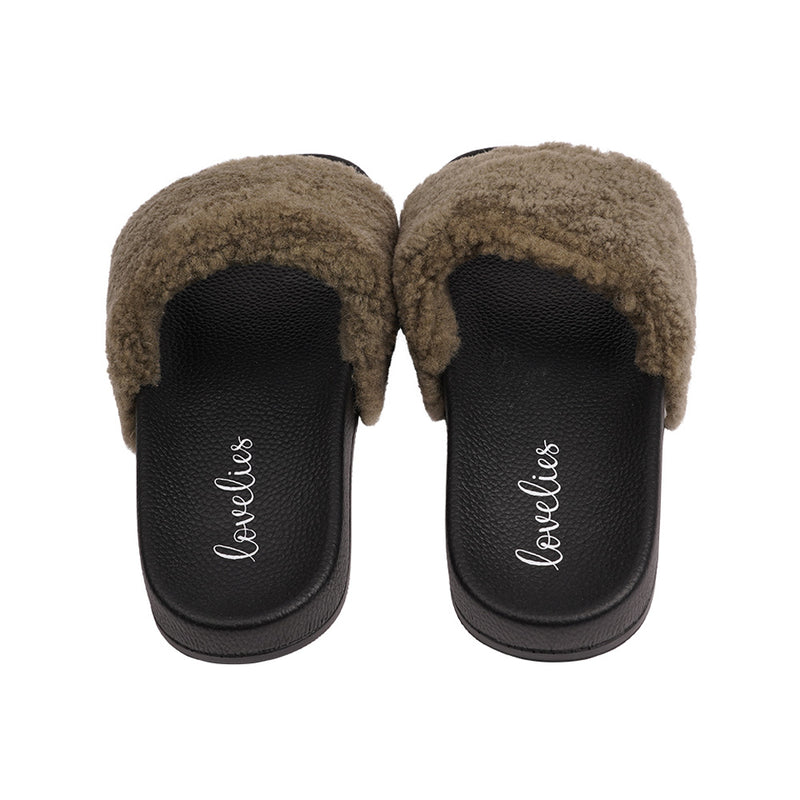 Slides with Australian Shearling upper.  This wonderful slide has a soft and light rubber sole which makes it very comfortable and an all time favorite sandal. The 100% shearling wool will keep you warm or cool you down on hot summer days.