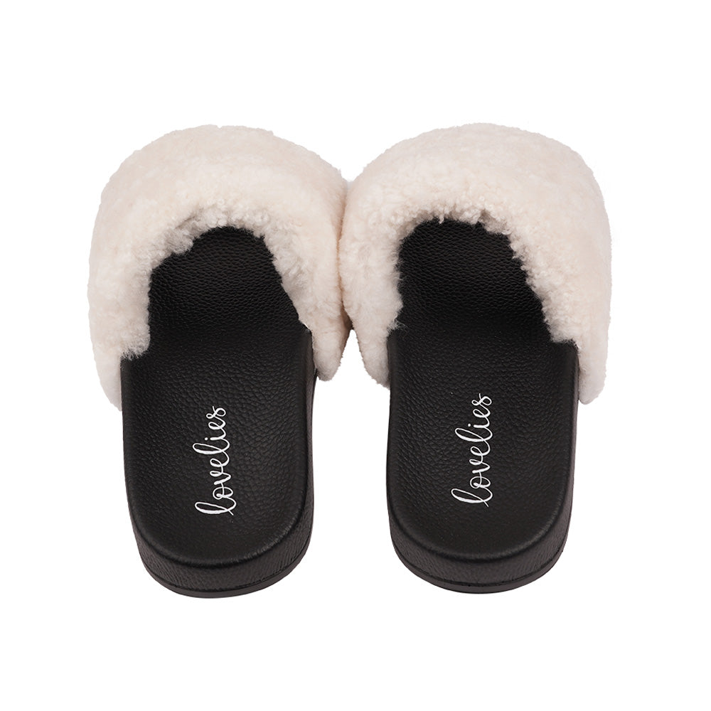 Slides with Australian Shearling upper.  This wonderful slide has a soft and light rubber sole which makes it very comfortable and an all time favorite sandal. The 100% shearling wool will keep you warm or cool you down on hot summer days.