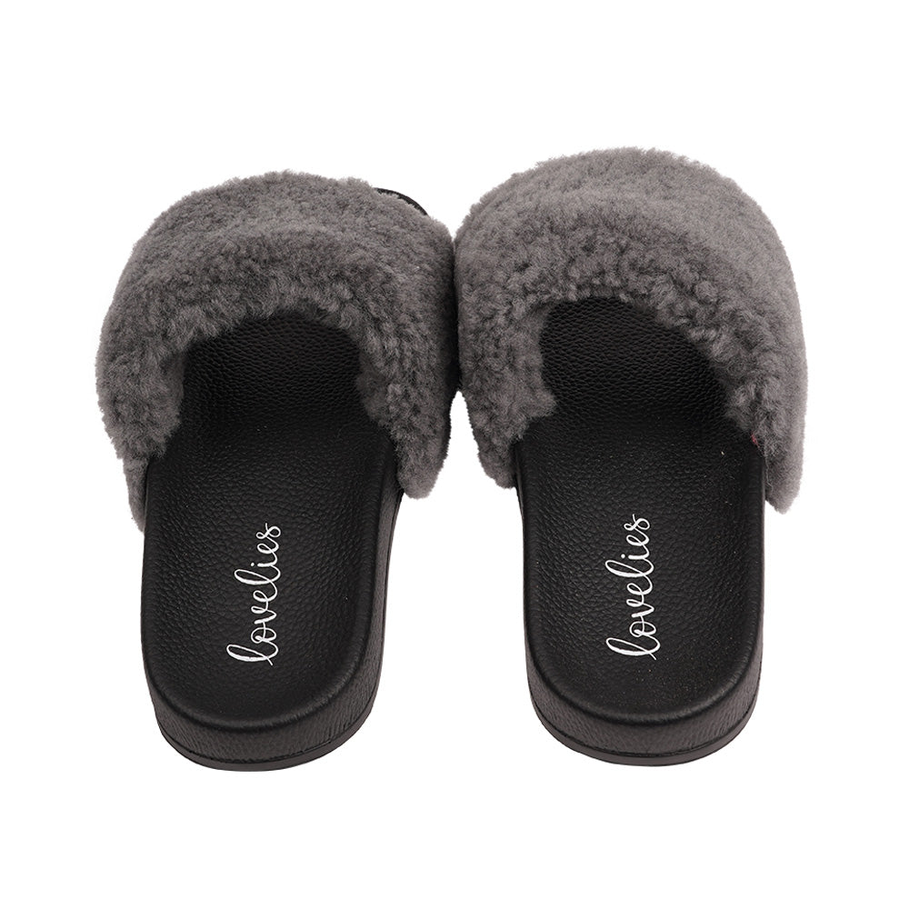 Slides with Australian Shearling upper.  This wonderful slide has a soft and light rubber sole which makes it very comfortable and an all time favorite sandal. The 100% shearling wool will keep you warm or cool you down on hot summer days.