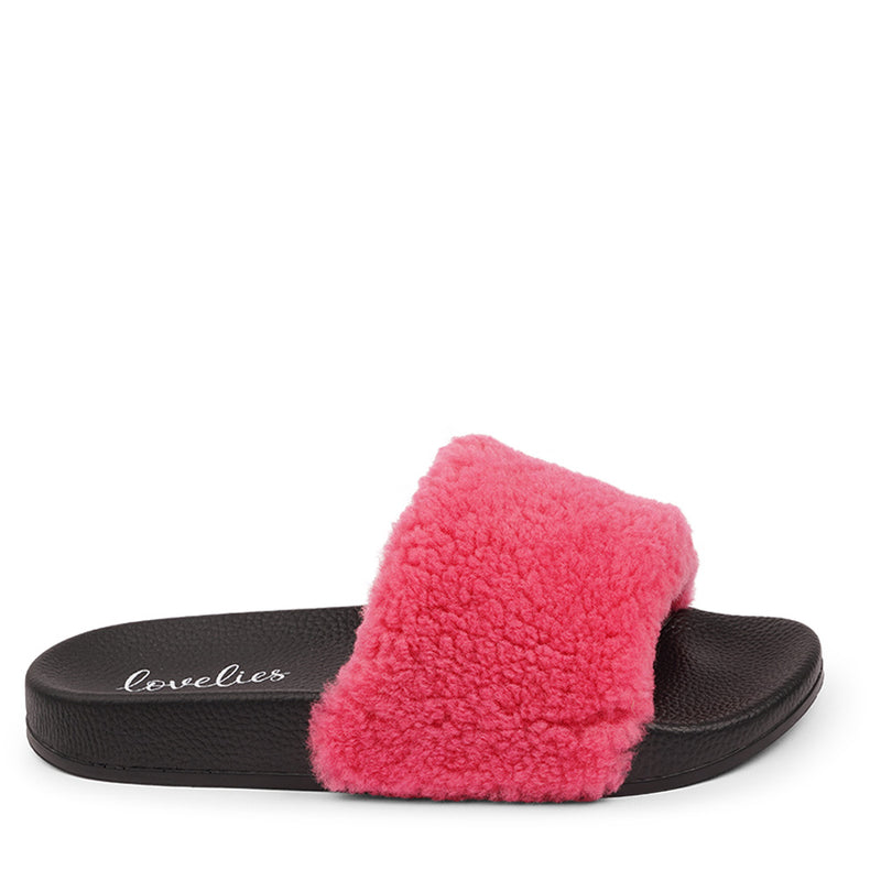 Slides with Australian Shearling upper.  This wonderful slide has a soft and light rubber sole which makes it very comfortable and an all time favorite sandal. The 100% shearling wool will keep you warm or cool you down on hot summer days.