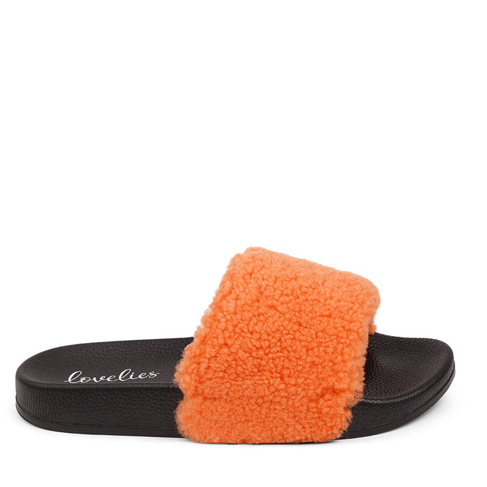 Slides with Australian Shearling upper.  This wonderful slide has a soft and light rubber sole which makes it very comfortable and an all time favorite sandal. The 100% shearling wool will keep you warm or cool you down on hot summer days.