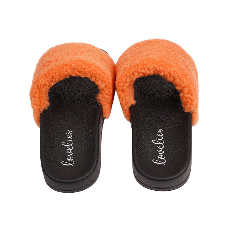 Slides with Australian Shearling upper.  This wonderful slide has a soft and light rubber sole which makes it very comfortable and an all time favorite sandal. The 100% shearling wool will keep you warm or cool you down on hot summer days.