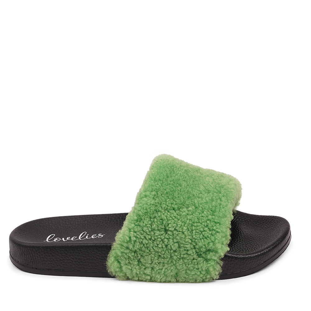 Slides with Australian Shearling upper.  This wonderful slide has a soft and light rubber sole which makes it very comfortable and an all time favorite sandal. The 100% shearling wool will keep you warm or cool you down on hot summer days.