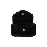 Lovelies Studio Understated and elegant, the little sister Corso shearling clutch with detachable crossbody strap comes in both black and cream. Corso is perfect for carrying your essentials with you for party or everyday use. Front flap with hidden magnetic fastening.   Adjustable and detachable wrist strap. Adjustable and detachable shoulder strap in leather. Shoulder strap 105 cm and 15 mm wide. Lining of suede and soft skin.  Flat zipped inner pocket.  Embossed Lovelies logo inside the bag 