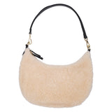 Kangmar is a beautiful shearling handbag which is perfect for carrying your essentials with you, it comes with detachable shoulder strap in skin. Top double zipped closure. Top handle in soft skin with hardware in gold. Adjustable and detachable shoulder strap in leather, 15 mm wide.  Satin lining and flat zipped inner pocket Item comes with a branded dust bag. Embossed Lovelies logo inside the bag.  Gold-toned hardware Measurements W36 X D5 X H20 cm 100 % Australian shearling 